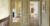 Interior of a Georgian townhouse showing two open doors on the left and right side of the frame leading to rooms filled with Modern British art