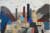 A collage by Julian Trevelyan made from newspaper cuttings and coloured card to depict an industrial town with factories and chimneys