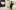 Photograph showing a young woman walking through an art gallery