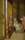 Painting by Walter Sickert showing a woman sitting in a chair next to a large wardrobe with a mirrored door
