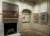 Interior of a Queen Anne townhouse with period fittings including a fireplace. A landscape painting by Sidney Nolan hangs above the fireplace and another in an alcove to the right. Two small pictures hang on a facing wall.