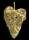 Gold plated metal in the shape of a leaf with intricate cutouts.
