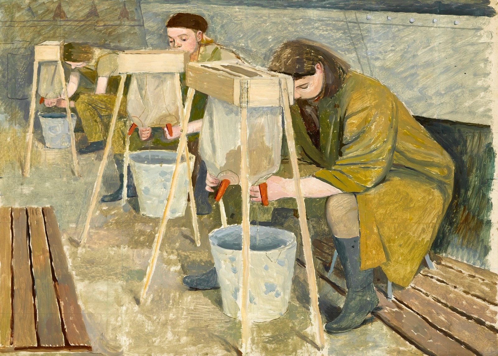 Three women sit in a row on wooden benches dressed in olive green robe and practicing squeezing liquid from artificial udders into buckets