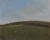 Landscape of green hill with white path top left corner and dotted with sheep and above blue sky with clouds