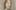Self-portrait of a woman with dark hair tied back looking outwards with a letter in her right hand held up to her chest