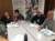 Photograph of six people sat around a table