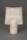 Photograph of a ceramic vase with a cylindrical base and a flared rectangular top in white