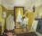 A painting of a man working in his art studio. He sits painting at an easel. Canvases and equipment lean against the edges of the room.